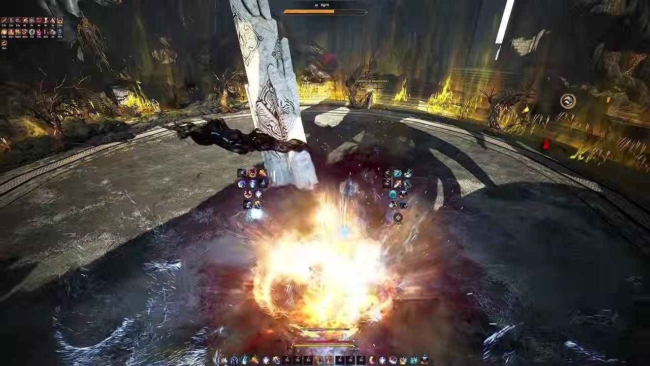 Game battle scene showing an illuminated explosion with a tall stone pillar in the center of the arena.