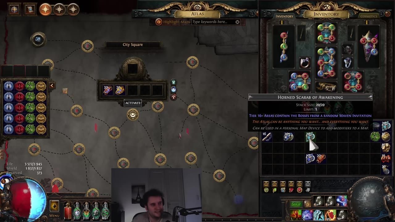 A game inventory screen is displayed showing various items and equipment. Scarabs including Horned Scarab of Awakening are visible.
